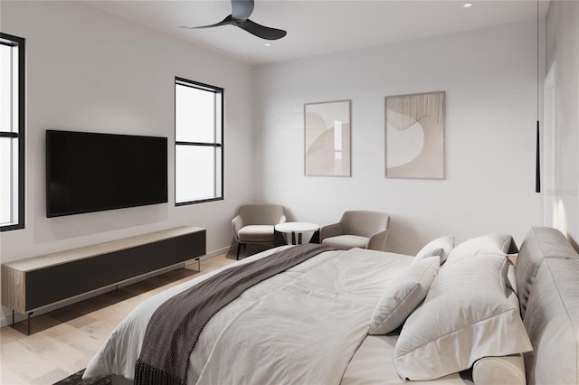 bedroom with light wood-type flooring and ceiling fan