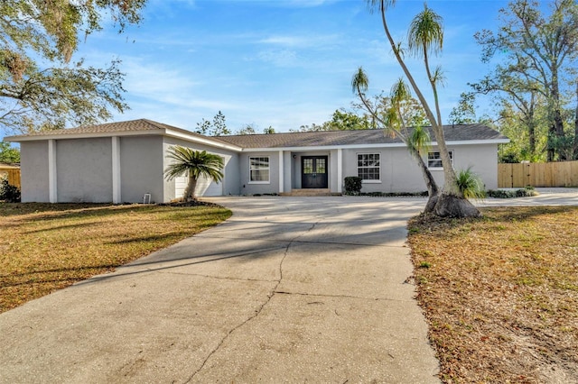 ranch-style house with a front lawn