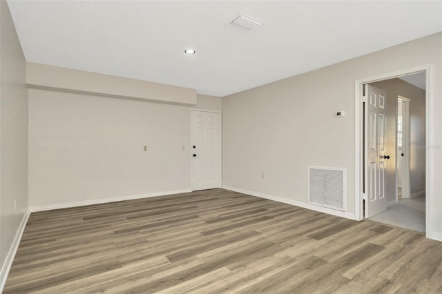 spare room featuring hardwood / wood-style floors