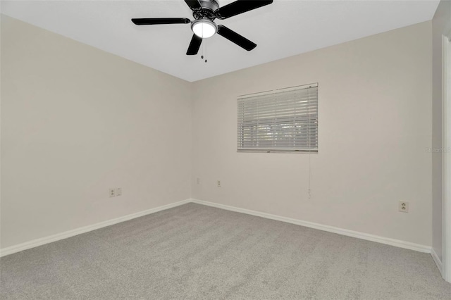 unfurnished room with ceiling fan and light colored carpet