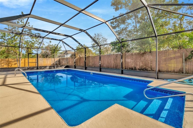 view of pool featuring a lanai and a patio area