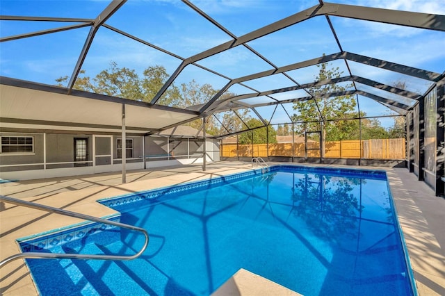 view of pool featuring a lanai and a patio area