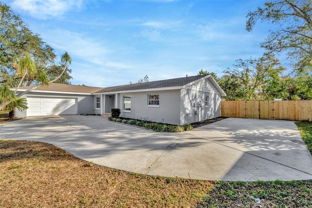 ranch-style house featuring a garage