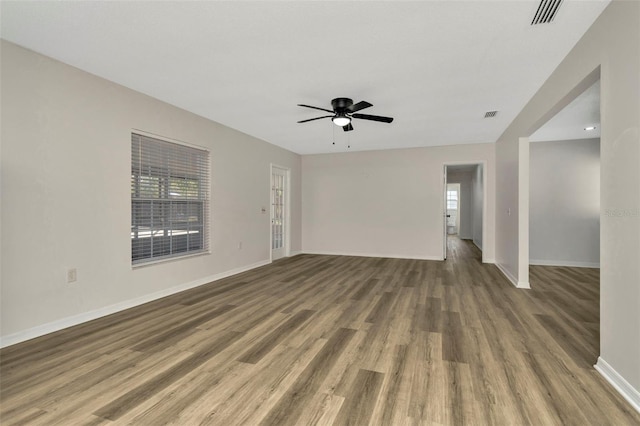 unfurnished room featuring wood-type flooring and ceiling fan