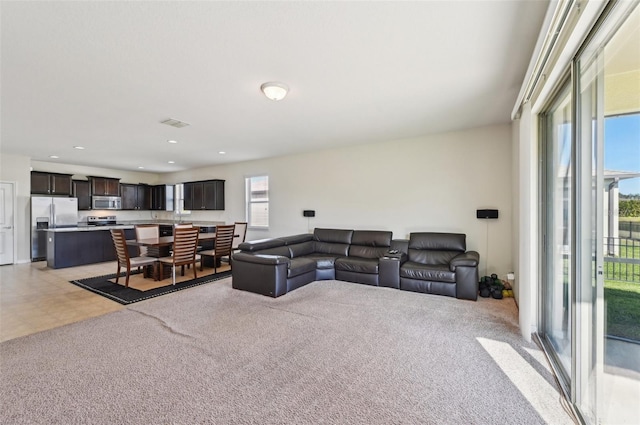 living room with light colored carpet