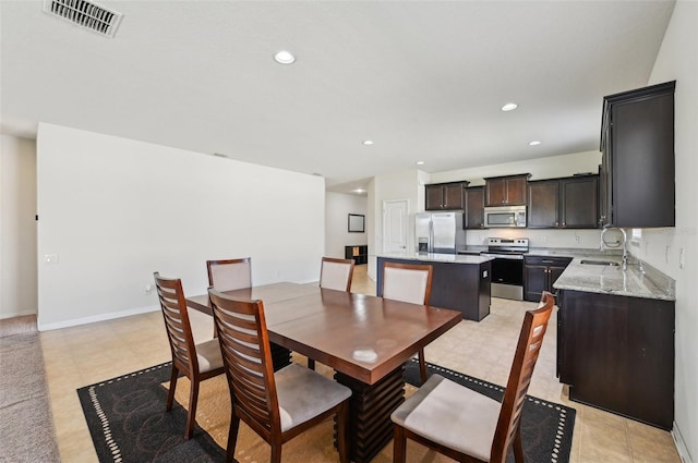 dining room featuring sink