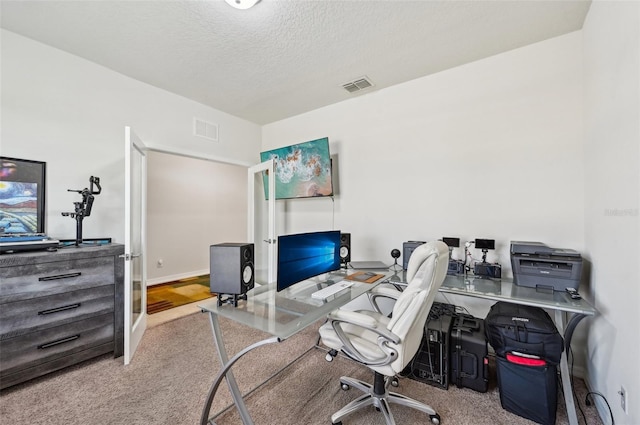 office space with a textured ceiling