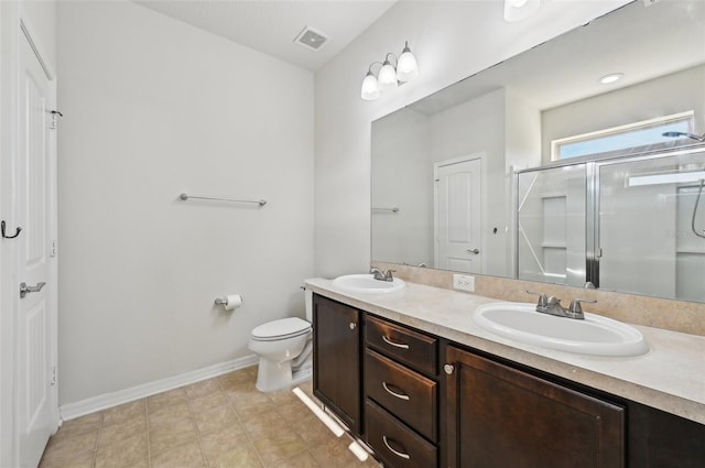 bathroom featuring walk in shower, vanity, and toilet