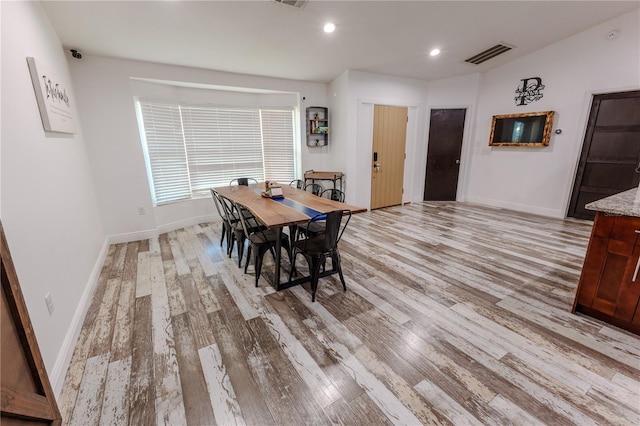 dining area with light hardwood / wood-style flooring