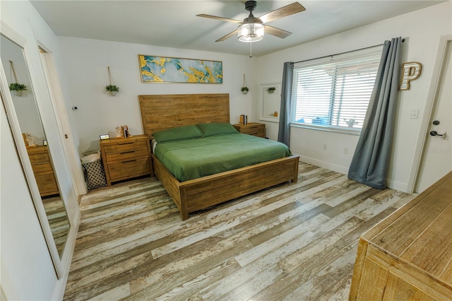 bedroom featuring light hardwood / wood-style floors and ceiling fan