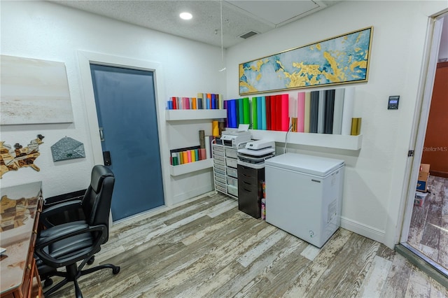 office area featuring hardwood / wood-style flooring and a textured ceiling