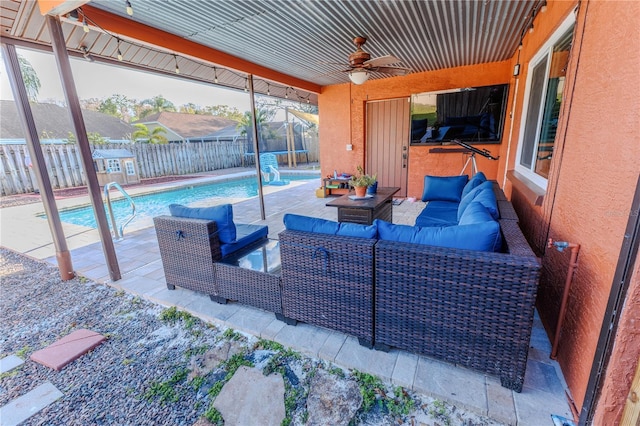 view of patio / terrace with a fenced in pool, outdoor lounge area, and ceiling fan