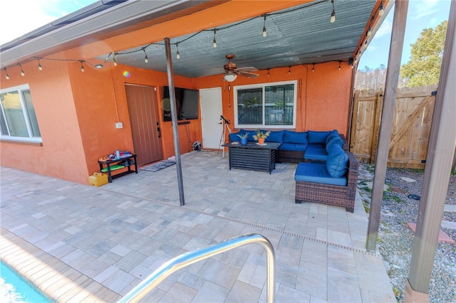 view of patio featuring an outdoor hangout area and ceiling fan