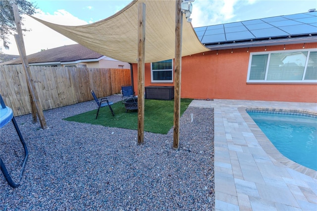 view of patio featuring a fenced in pool