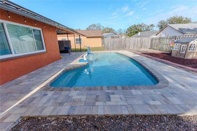 view of swimming pool with a patio