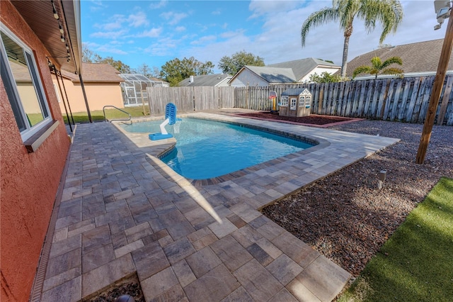 view of swimming pool with a patio