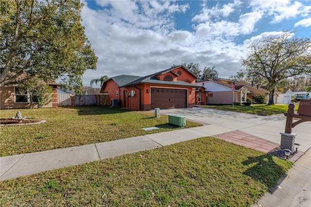 view of front facade with central AC unit, a garage, and a front lawn