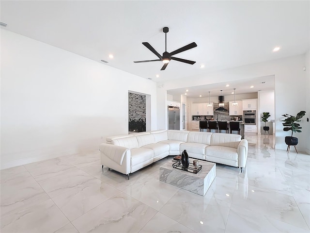 living room featuring ceiling fan