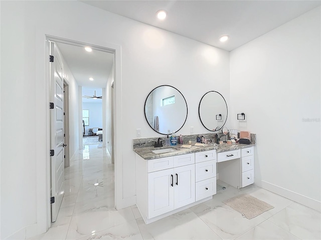 bathroom with ceiling fan and vanity