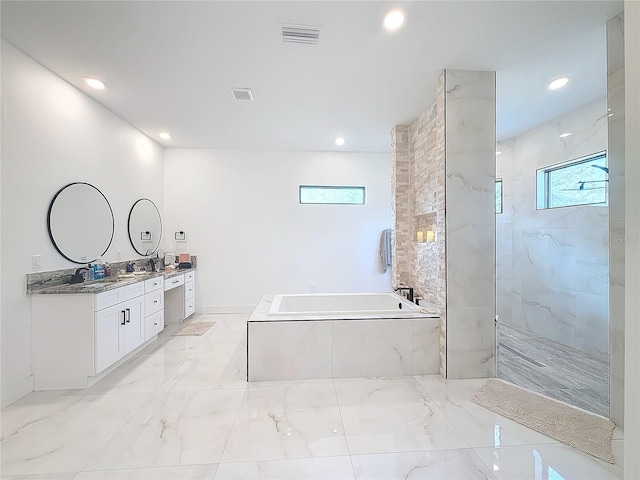 bathroom featuring separate shower and tub and vanity