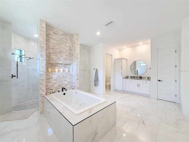 full bathroom featuring toilet, separate shower and tub, and vanity