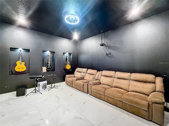 cinema room featuring a textured ceiling