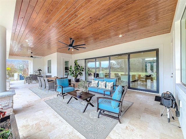 view of patio / terrace with ceiling fan and an outdoor living space