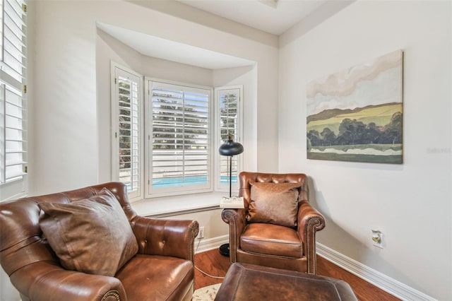 sitting room with hardwood / wood-style floors