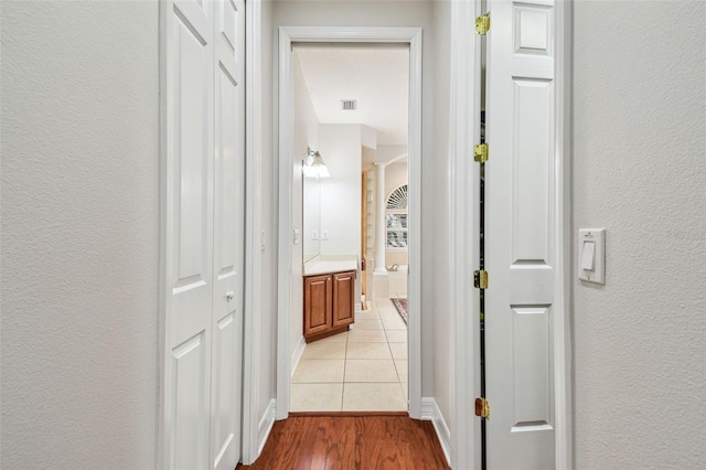 hall with light hardwood / wood-style flooring