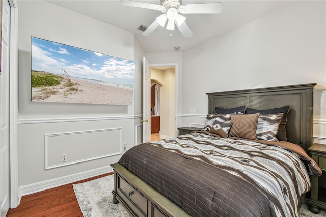 bedroom featuring ceiling fan and dark hardwood / wood-style floors