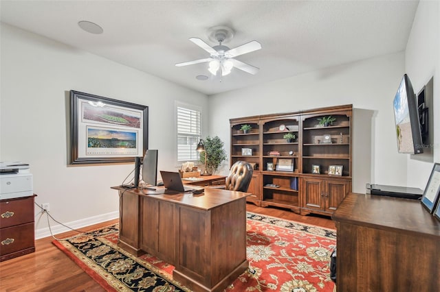 office space with ceiling fan and light hardwood / wood-style flooring