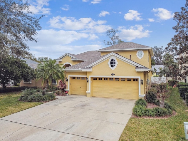 view of front of property featuring a garage and a front yard