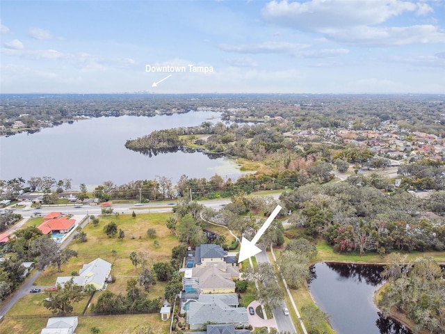 birds eye view of property with a water view