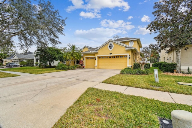 view of front of home with a garage and a front yard