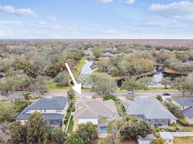 birds eye view of property with a residential view and a water view