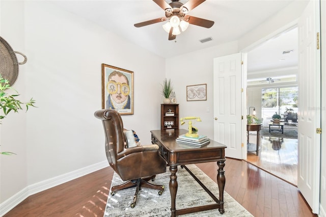 office with hardwood / wood-style flooring, a ceiling fan, and baseboards