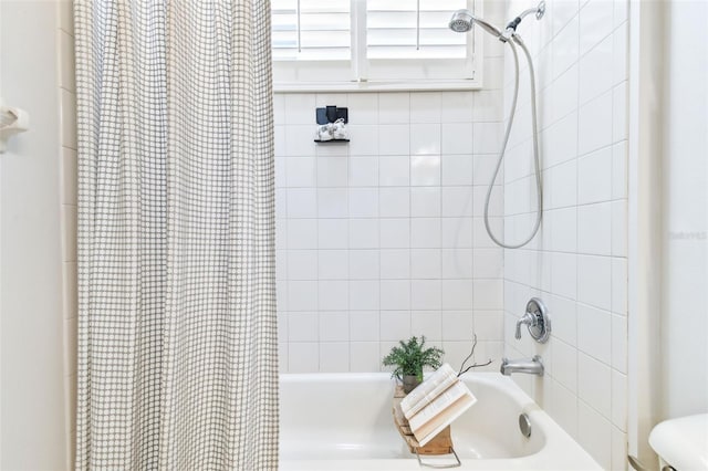 bathroom featuring shower / bathtub combination with curtain