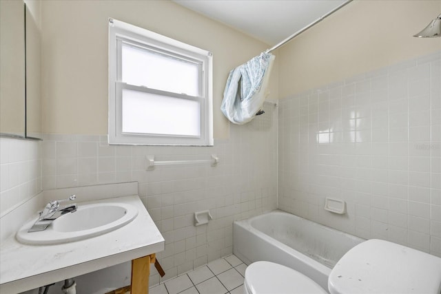 full bathroom featuring tile patterned floors, vanity, tile walls, toilet, and shower / bath combo with shower curtain