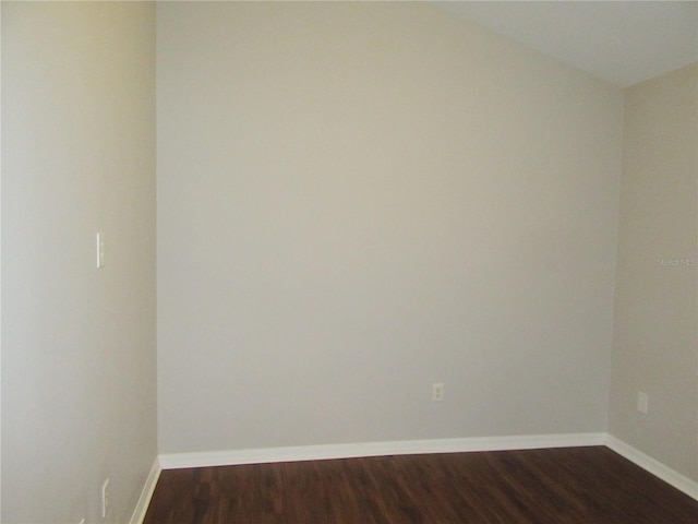 empty room featuring dark hardwood / wood-style floors