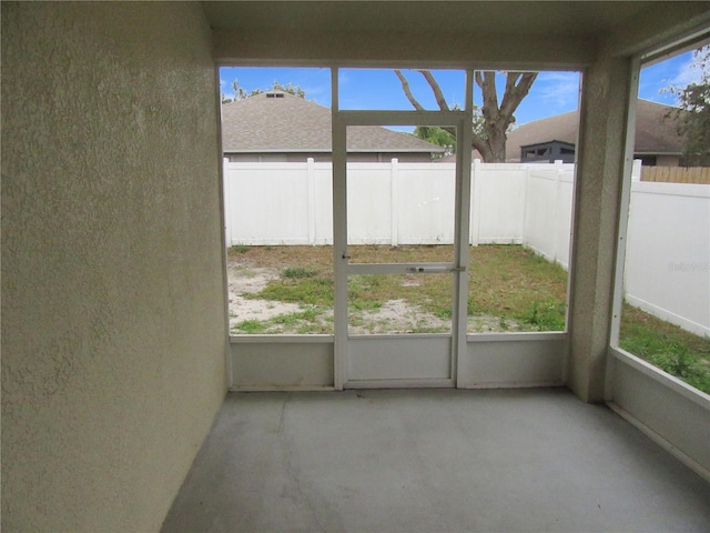 unfurnished sunroom with a healthy amount of sunlight