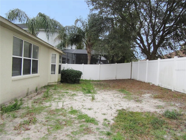 view of yard with a lanai