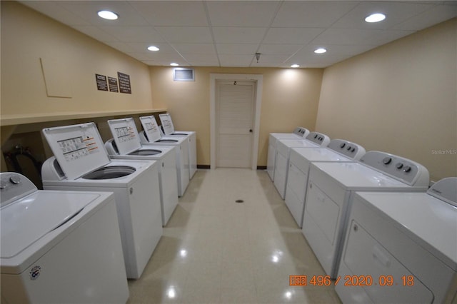 washroom with washing machine and clothes dryer