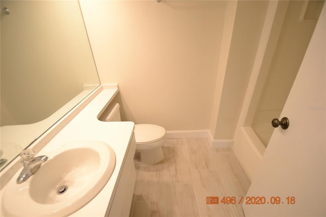 bathroom with toilet and sink