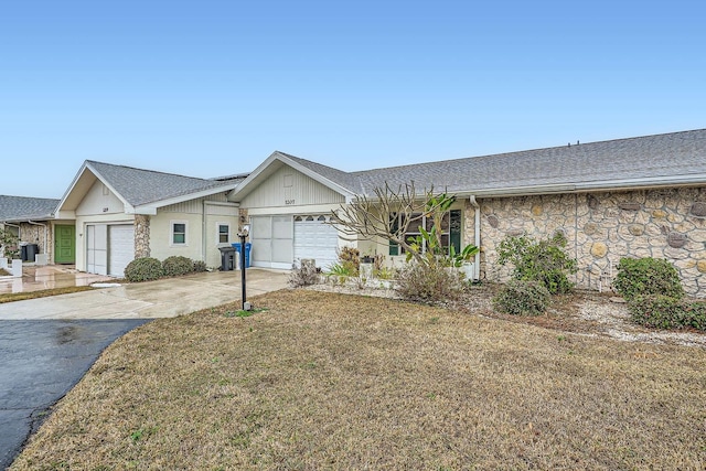 ranch-style home featuring a garage and a front yard