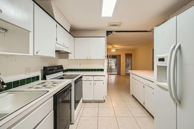 kitchen featuring white appliances, white cabinets, sink, ceiling fan, and light tile patterned flooring