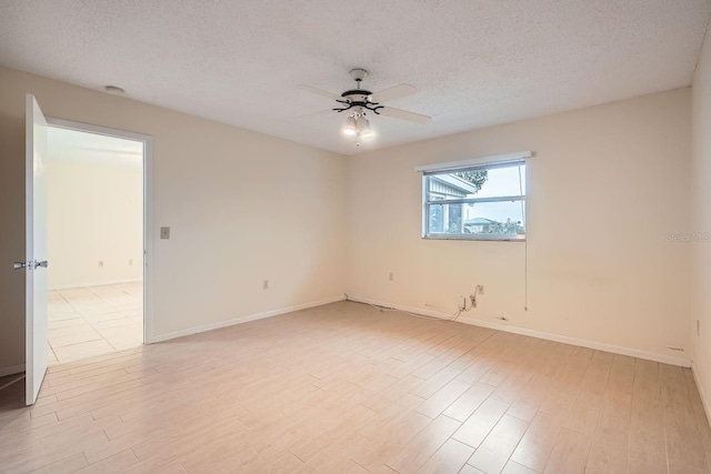 unfurnished room with light wood-type flooring, ceiling fan, and a textured ceiling