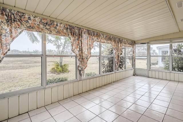 unfurnished sunroom with vaulted ceiling