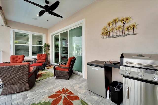 view of patio / terrace with ceiling fan, an outdoor hangout area, and a grill