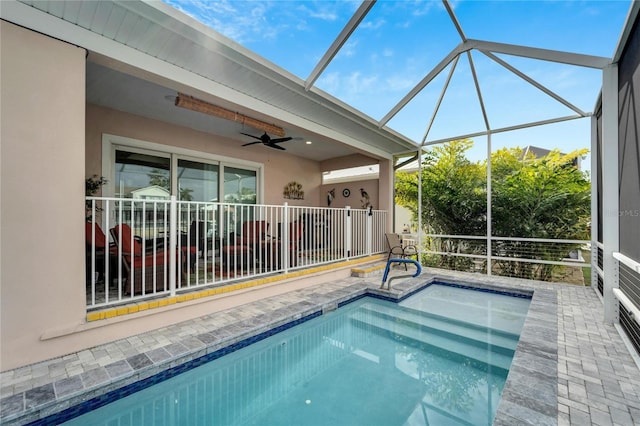 view of pool featuring ceiling fan, a lanai, and a patio