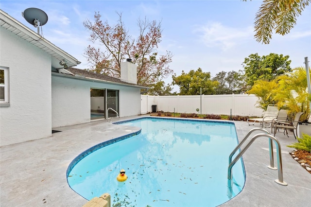 view of pool featuring a patio area